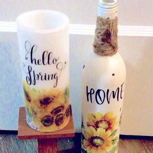 Battery operated candle with sunflowers and decorative bottle